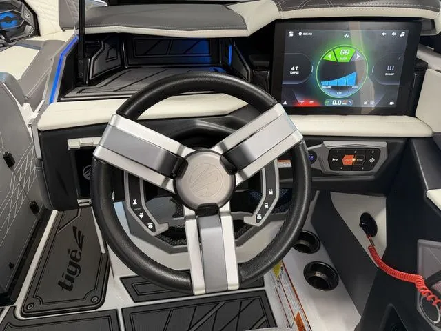 Slide: The Image of 2024 Tigé Ultré 25ZX interior with modern steering wheel and touchscreen display. - 15