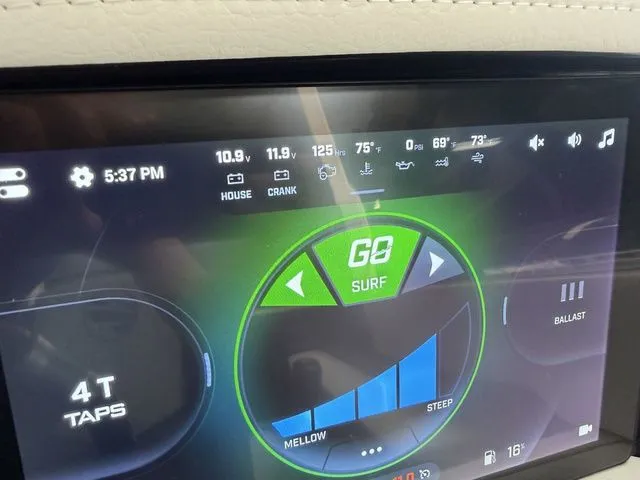Slide: The Image of Tigé Ultré 25ZX 2024 boat display with surf control and performance data. - 16