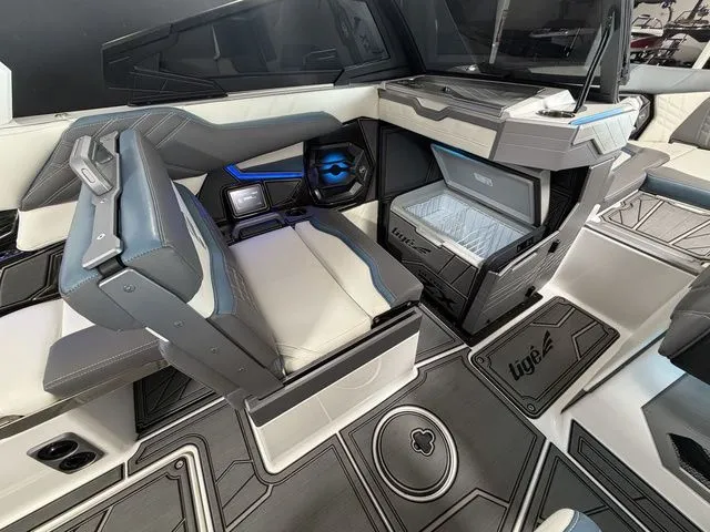 Slide: The Image of Interior of 2024 Tigé Ultré 25ZX featuring luxurious seating area. - 17