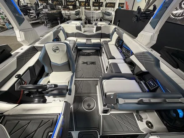 Slide: The Image of Interior of 2024 Tigé Ultré 25ZX boat with luxurious features. - 20