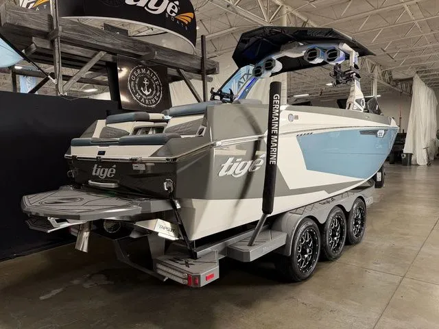 Slide: The Image of 2024 Tigé Ultré 25ZX boat displayed in a showroom. - 4
