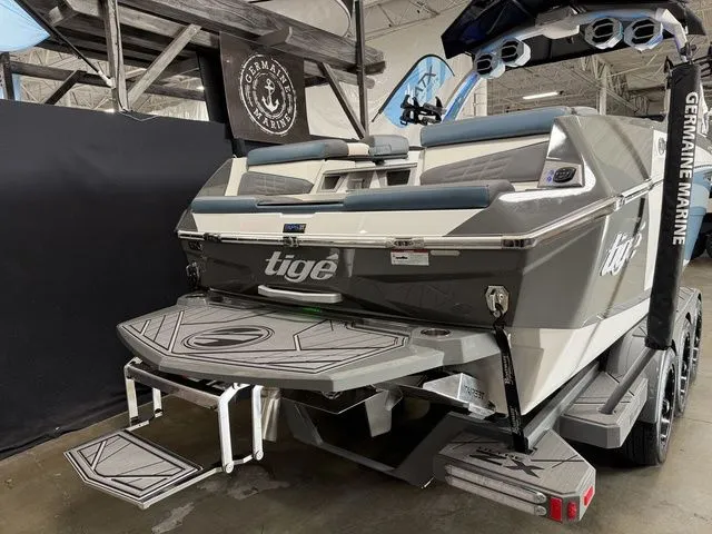Slide: The Image of 2024 Tigé Ultré 25ZX boat in showroom display. - 6