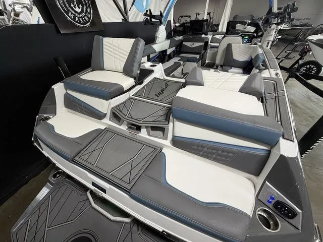 Slide: The Image of 2024 Tigé Ultré 25ZX boat interior with luxurious seating. - 7