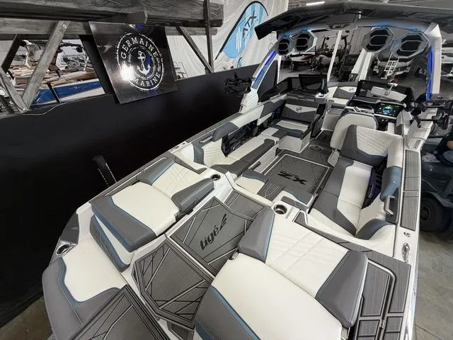 Slide: The Image of Interior view of 2024 Tigé Ultré 25ZX boat with luxurious features. - 9