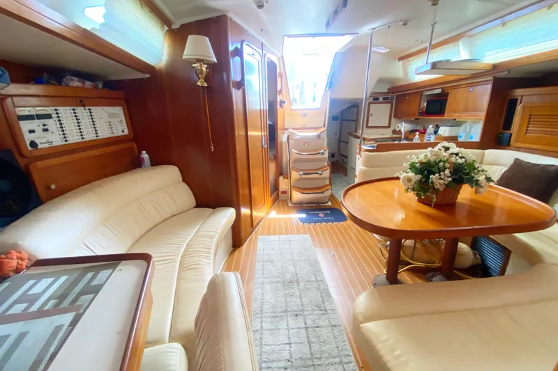 Slide: The Image of Luxurious interior of a 2004 Catalina 42 MkII sailboat with elegant wood finishes. - 29