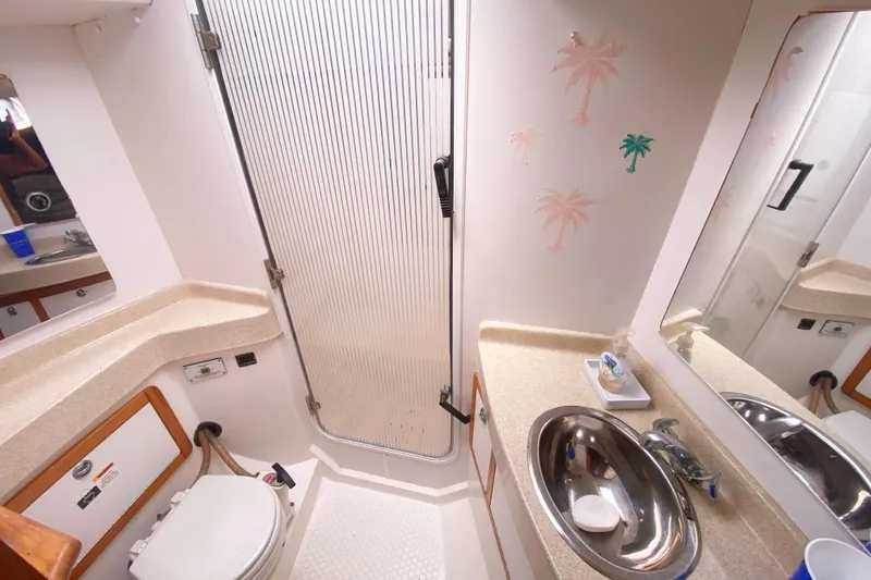 Slide: The Image of Bathroom interior of a 2004 Catalina 42 MkII yacht with shower and sink. - 32