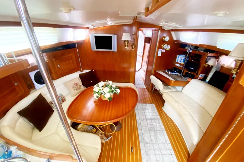 Slide: The Image of Luxurious interior of a 2004 Catalina 42 MkII yacht with elegant wood finishes. - 21