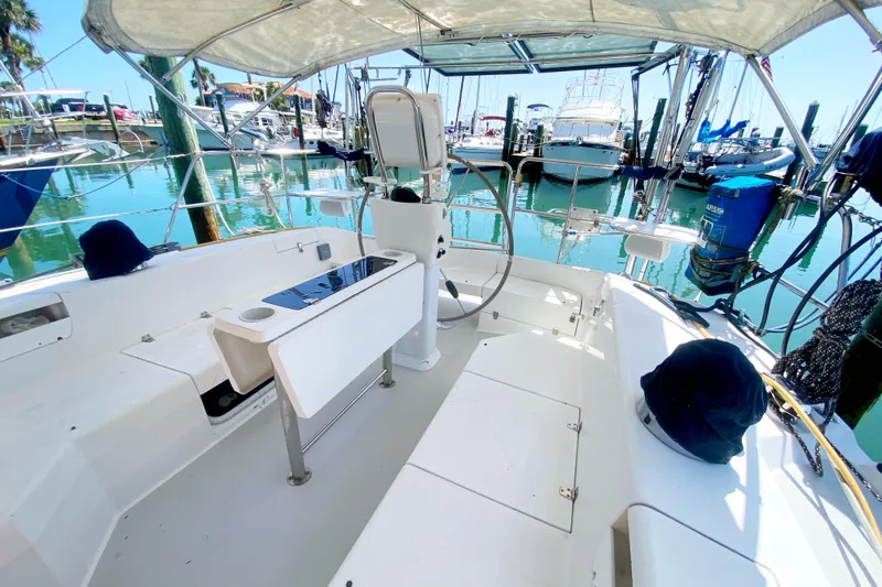 Slide: The Image of Cockpit of a 2004 Catalina 42 MkII sailboat docked in a marina. - 11