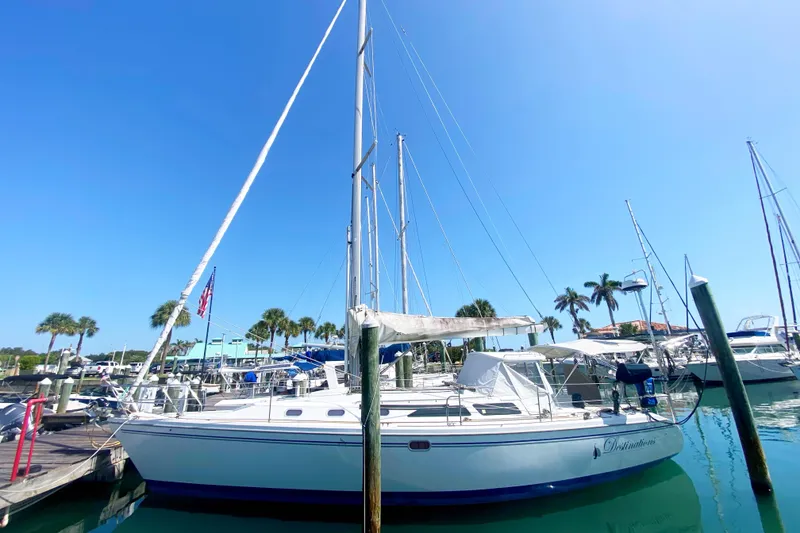 Slide: The Image of 2004 Catalina 42 MkII sailboat docked at marina under clear blue sky. - 1