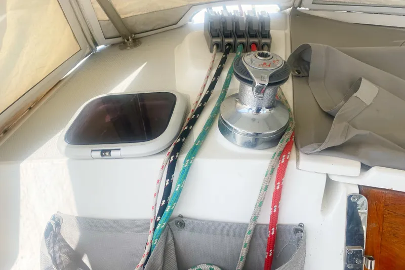 Slide: The Image of Sailing equipment on a 2004 Catalina 42 MkII yacht, featuring winch and ropes. - 19