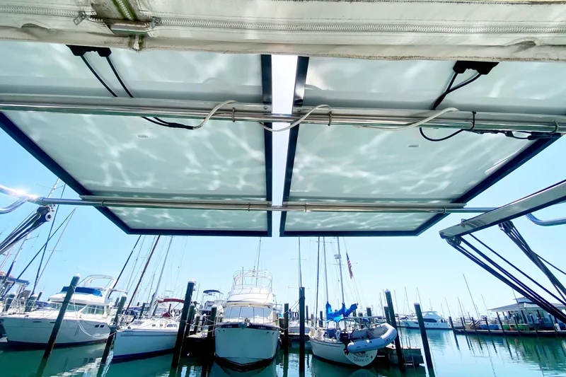 Slide: The Image of View from a 2004 Catalina 42 MkII sailboat, showcasing marina and solar panels. - 15