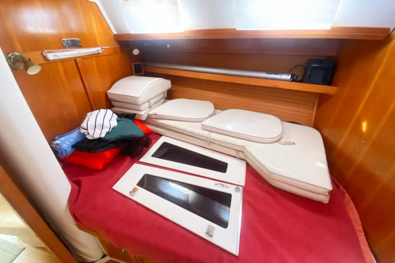 Slide: The Image of Interior cabin of 2004 Catalina 42 MkII sailboat with cushions and storage. - 31