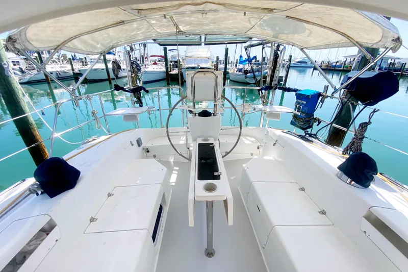 Slide: The Image of Cockpit view of a 2004 Catalina 42 MkII sailboat docked at a marina. - 10