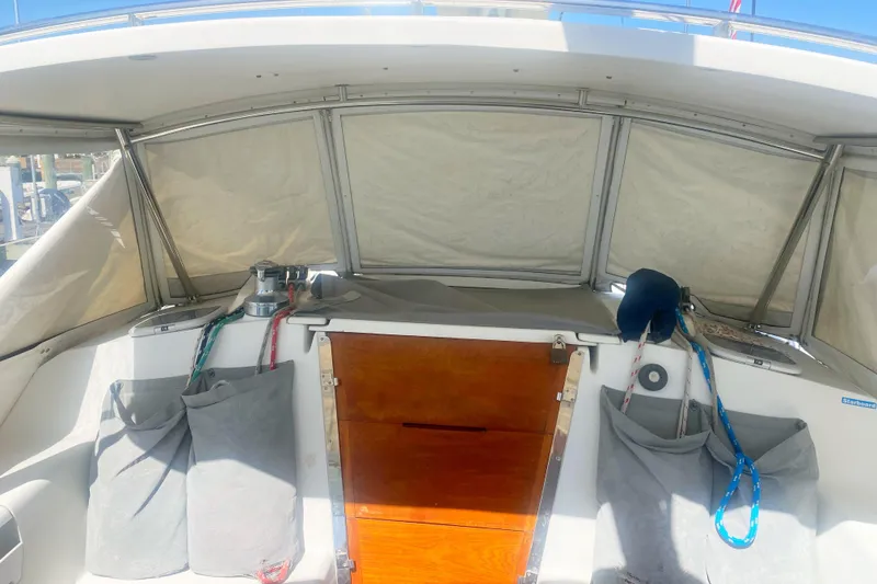 Slide: The Image of Cockpit of a 2004 Catalina 42 MkII sailboat with covered seating and storage pockets. - 17