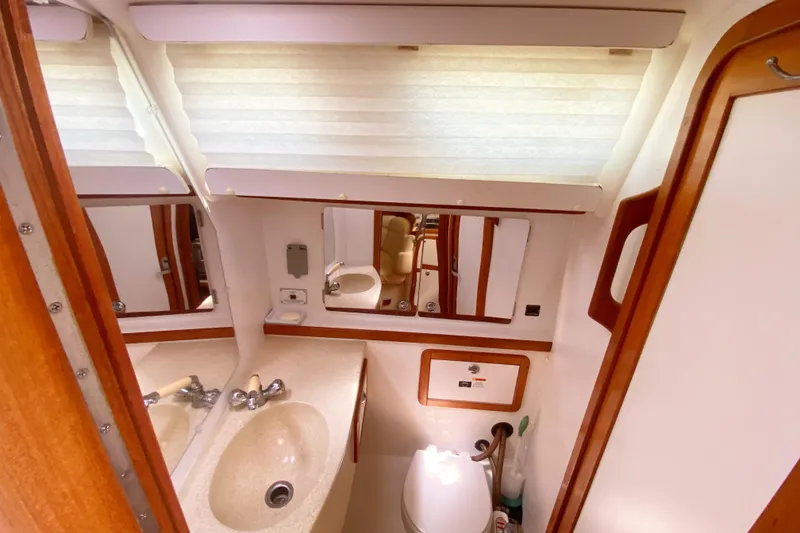 Slide: The Image of Bathroom interior of a 2004 Catalina 42 MkII yacht with sink and mirror. - 37