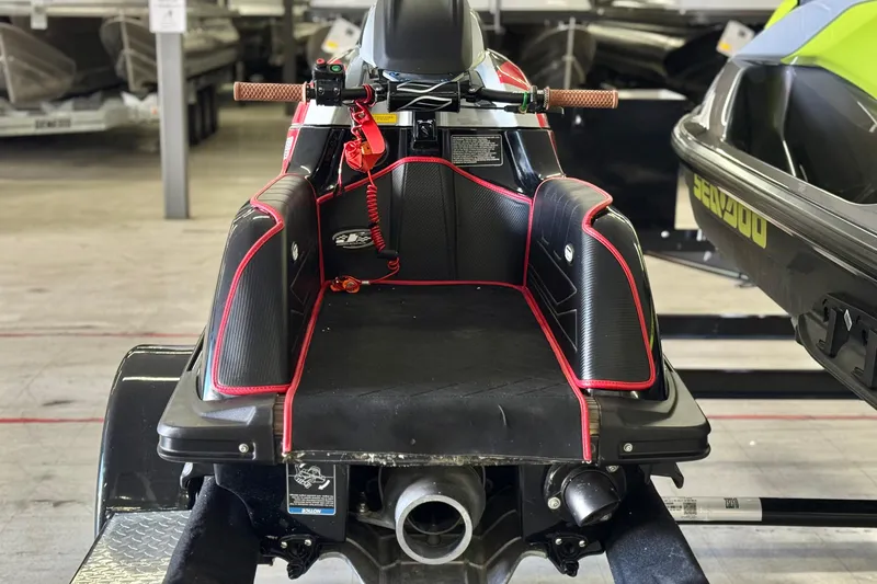 Slide: The Image of 2024 Kawasaki Jetski SX-R in a showroom, showcasing sleek design and vibrant accents. - 3