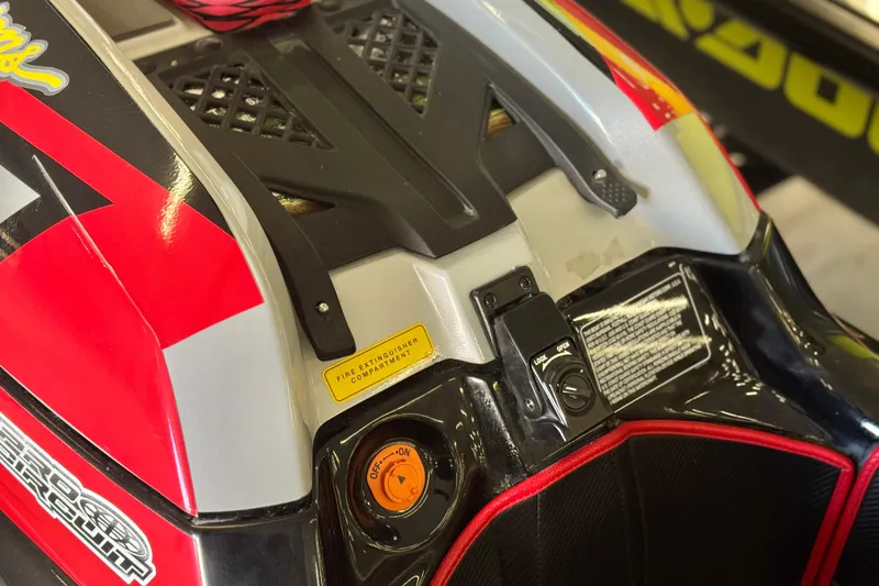 Slide: The Image of 2024 Kawasaki Jetski SX-R close-up showing control panel and vibrant red design. - 7