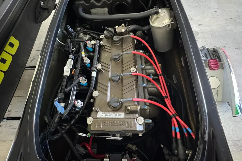 Slide: The Image of Engine compartment of a 2024 Kawasaki Jetski SX-R, showcasing intricate wiring and components. - 8