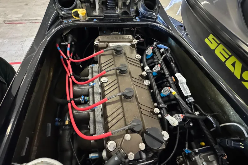 Slide: The Image of Engine compartment of a 2024 Kawasaki Jetski SX-R, showcasing intricate wiring and components. - 9