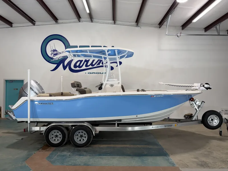 The Image of 2019 Tidewater 210 LXF boat on trailer in warehouse. - 1