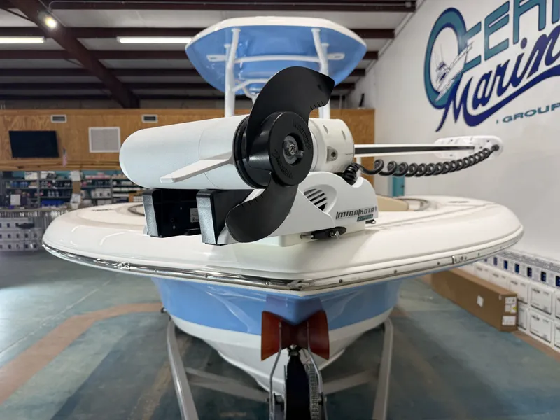 Slide: The Image of 2019 Tidewater 210 LXF boat with Minn Kota motor in a workshop. - 10