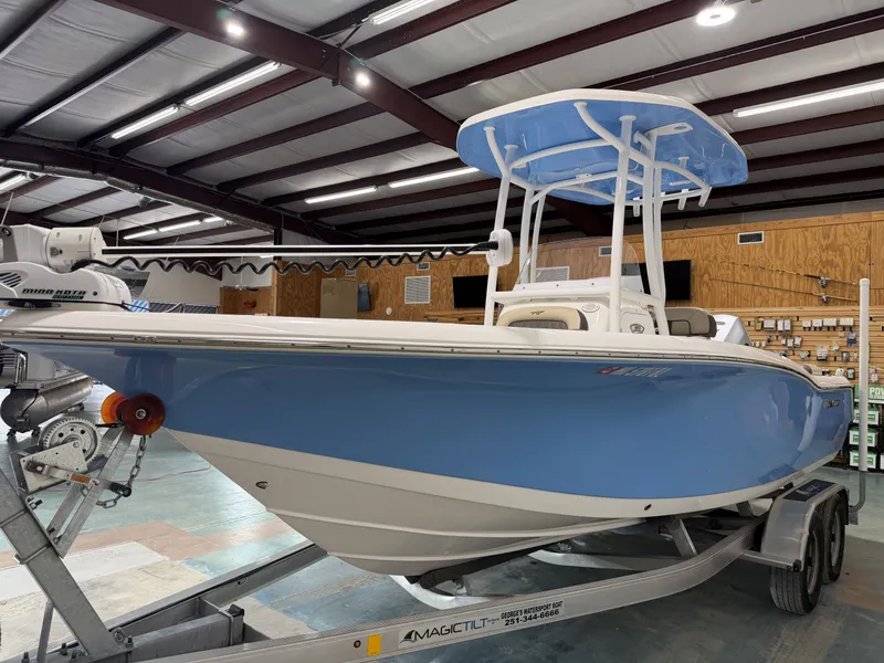Slide: The Image of 2019 Tidewater 210 LXF boat in a warehouse on a trailer. - 11