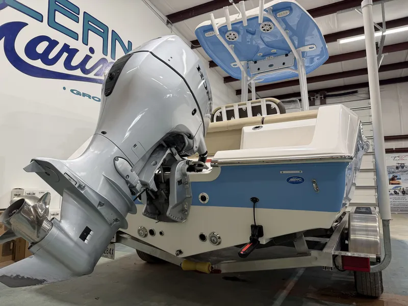 Slide: The Image of 2019 Tidewater 210 LXF boat with outboard motor in a workshop. - 12