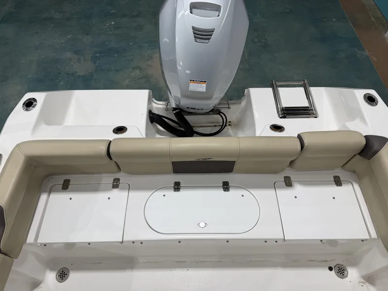 Slide: The Image of Rear view of a 2019 Tidewater 210 LXF boat with engine. - 13