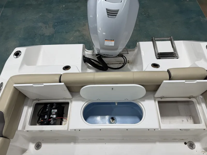 Slide: The Image of Rear view of 2019 Tidewater 210 LXF boat with engine and storage compartments. - 14