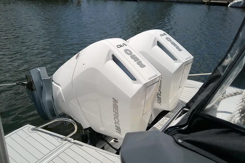 Slide: The Image of 2024 Beneteau Gran Turismo 36 with dual Mercury outboard engines on water. - 11