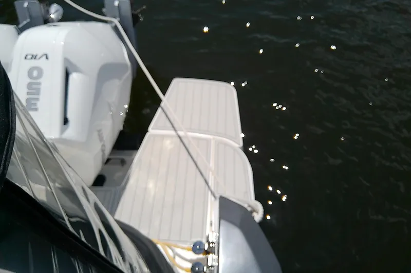 Slide: The Image of 2024 Beneteau Gran Turismo 36 boat with outboard motor on water. - 14