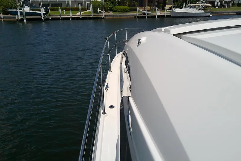 Slide: The Image of 2024 Beneteau Gran Turismo 36 yacht, sleek design, docked in a serene marina. - 15