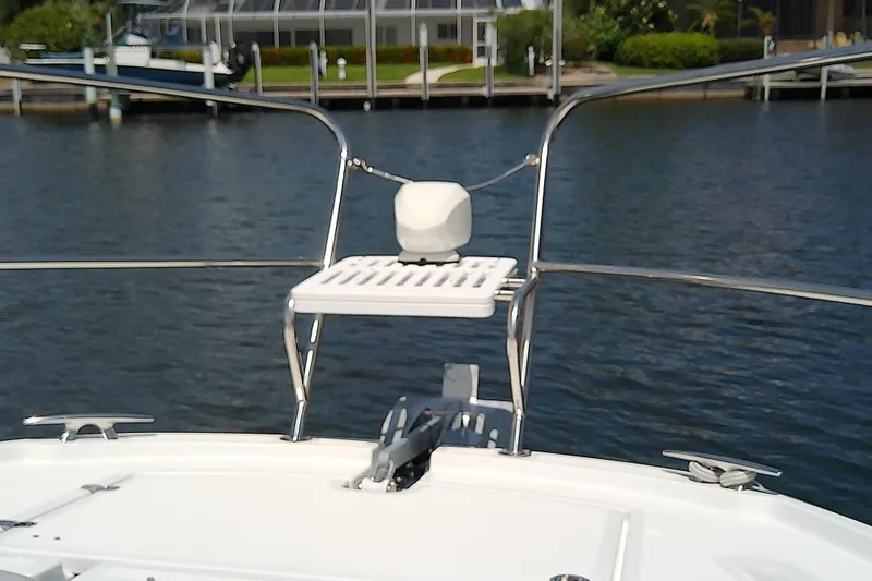 Slide: The Image of 2024 Beneteau Gran Turismo 36 yacht bow with stainless steel railings and water view. - 20