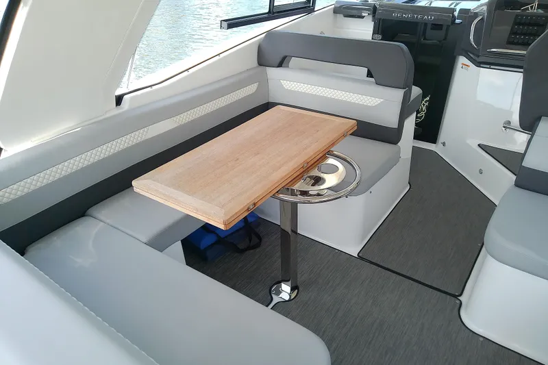 Slide: The Image of Interior of 2024 Beneteau Gran Turismo 36, featuring a sleek seating area with a wooden table. - 29