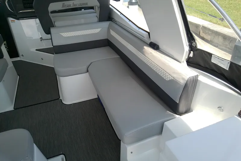 Slide: The Image of Interior seating of 2024 Beneteau Gran Turismo 36, featuring sleek gray upholstery. - 30