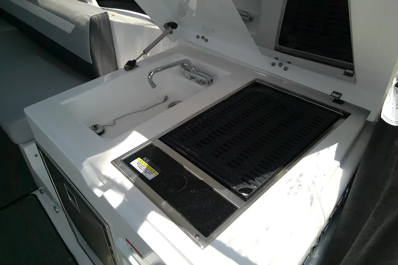 Slide: The Image of 2024 Beneteau Gran Turismo 36 yacht kitchenette with sink and grill. - 33