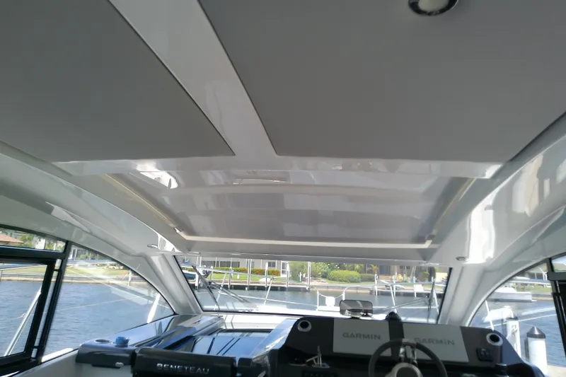 Slide: The Image of Interior view of 2024 Beneteau Gran Turismo 36 yacht cockpit with modern design. - 36