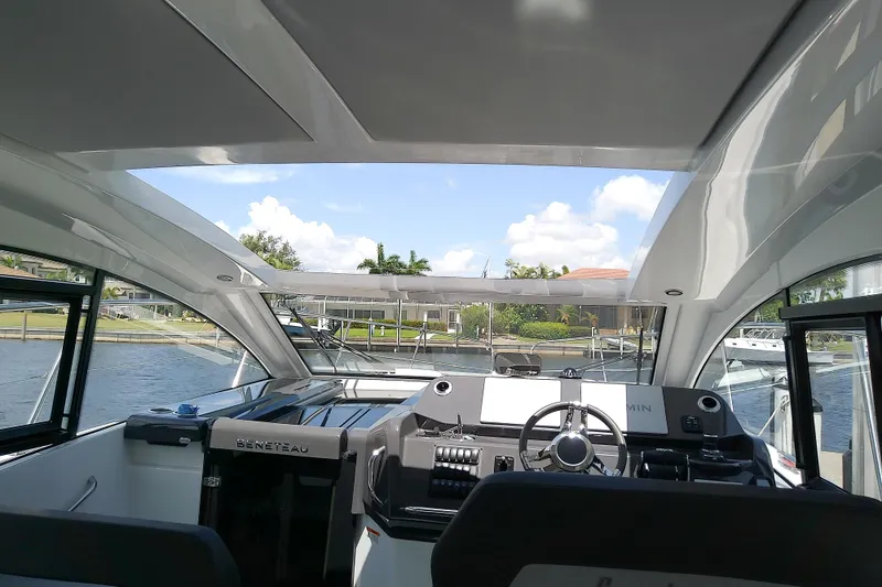 Slide: The Image of 2024 Beneteau Gran Turismo 36 cockpit with modern controls and panoramic view. - 38