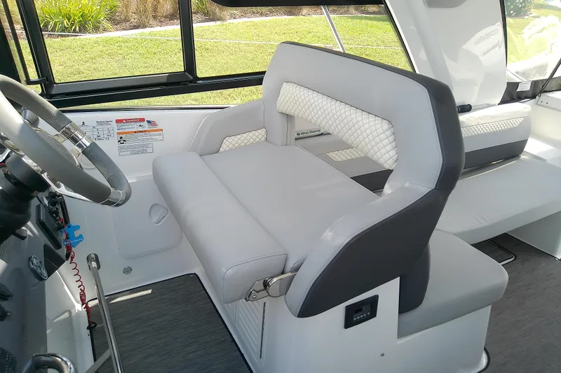 Slide: The Image of 2024 Beneteau Gran Turismo 36 cockpit with modern steering and plush seating. - 40