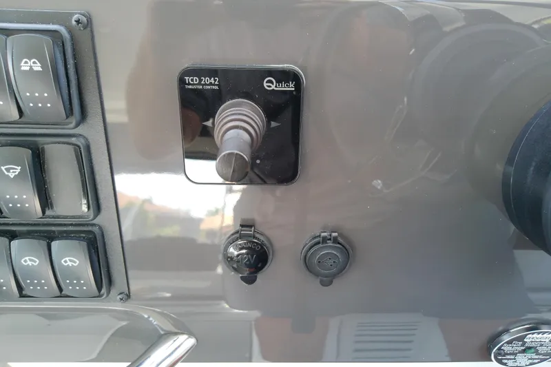 Slide: The Image of Control panel of 2024 Beneteau Gran Turismo 36 with thruster and switches. - 48