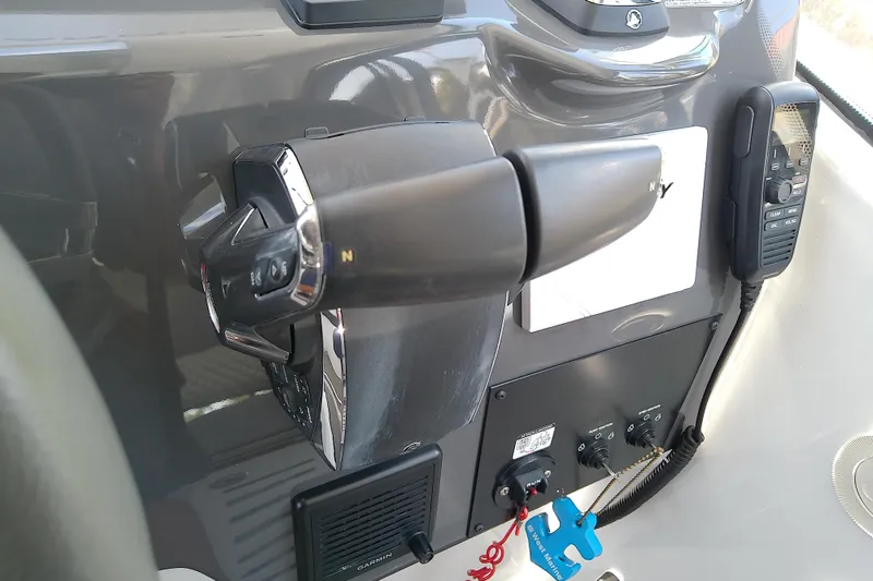 Slide: The Image of Control panel of 2024 Beneteau Gran Turismo 36 yacht with throttle and communication device. - 49