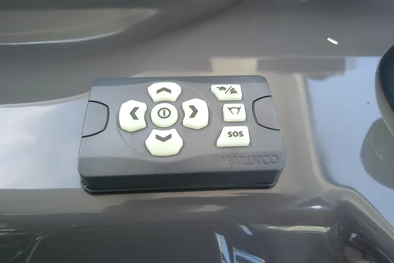 Slide: The Image of Control panel on 2024 Beneteau Gran Turismo 36 yacht, featuring navigation and SOS buttons. - 50