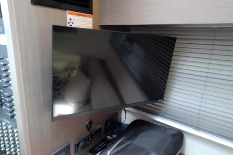 Slide: The Image of Flat-screen TV in the interior of a 2024 Beneteau Gran Turismo 36 yacht. - 57
