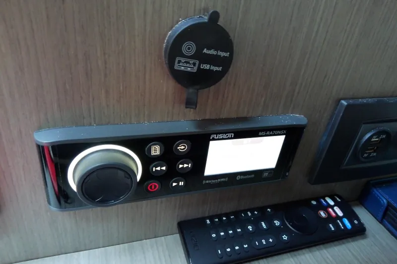 Slide: The Image of Audio system controls on 2024 Beneteau Gran Turismo 36 yacht dashboard. - 58