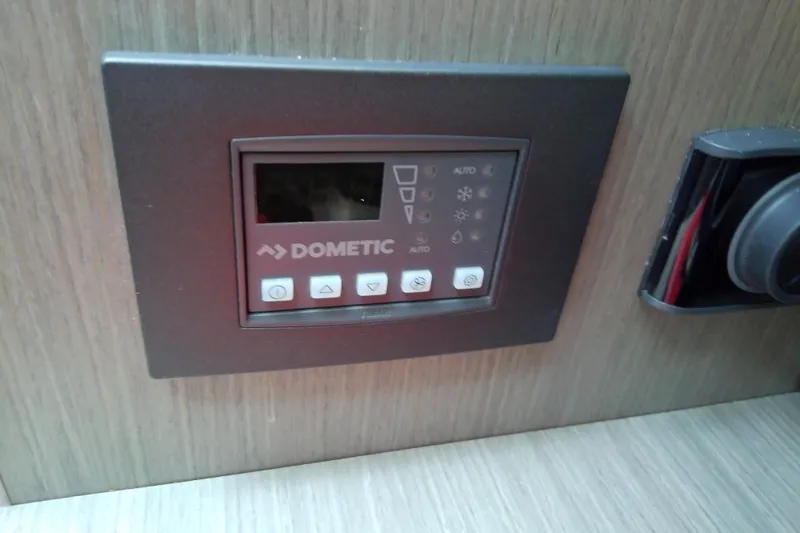 Slide: The Image of Dometic control panel on 2024 Beneteau Gran Turismo 36 yacht interior. - 59