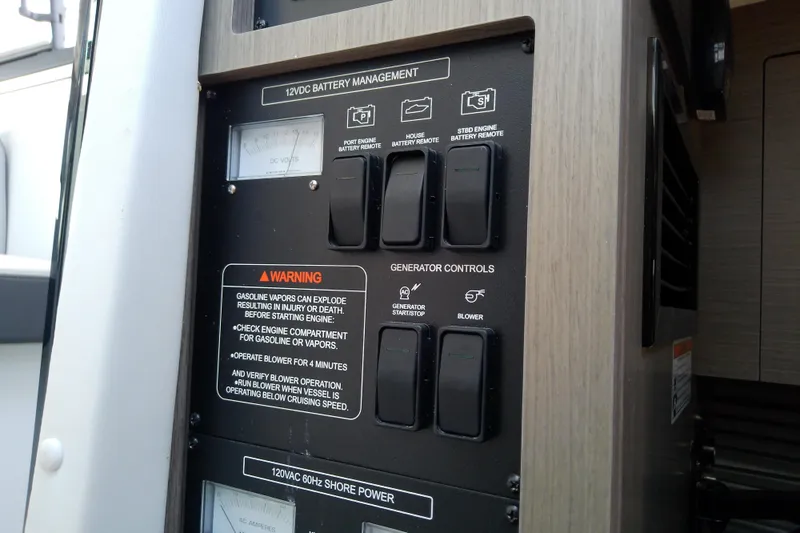 Slide: The Image of Control panel of 2024 Beneteau Gran Turismo 36, featuring battery management and generator controls. - 60