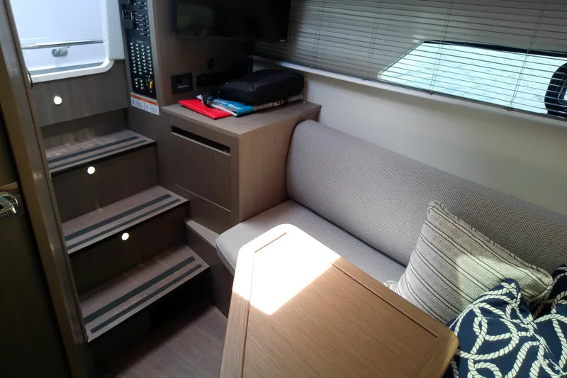 Slide: The Image of Interior of 2024 Beneteau Gran Turismo 36 yacht, featuring cozy seating and modern design. - 63
