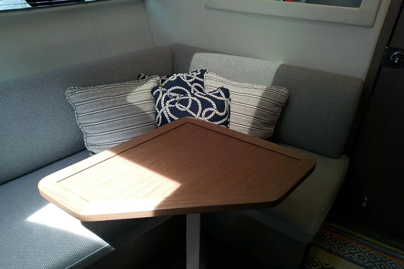 Slide: The Image of Cozy seating area with cushions on the 2024 Beneteau Gran Turismo 36 yacht. - 64
