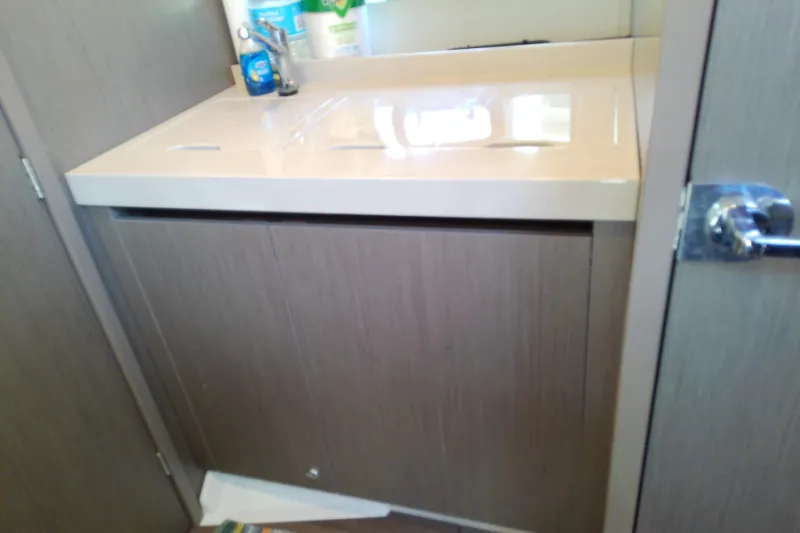 Slide: The Image of Bathroom sink area in 2024 Beneteau Gran Turismo 36 yacht, featuring modern cabinetry. - 68