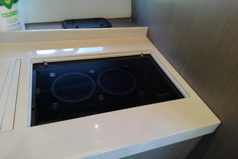 Slide: The Image of Modern stovetop in 2024 Beneteau Gran Turismo 36 yacht kitchen. - 69